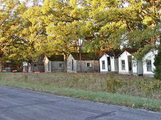 John’s Modern Cabins, Route 66in Newburg, Missouri wood cabins under shady trees
