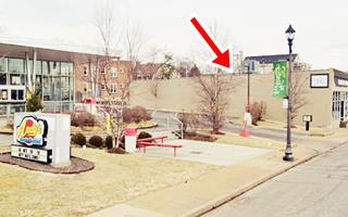 color view of a fast food outlet with north wall marked with a red arrow