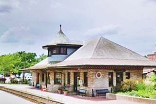 Stone building with cupola and hipped roof, historic Kirkwood railway station
