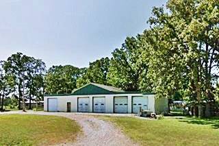 Log City as it looks today, Plew MO building under shady trees