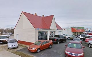 former Mobil station Lebanon hipped roof gabled gas station and cars nowadays