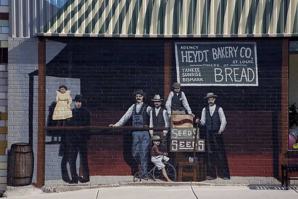 1920s men and child by bakery on a Mural in Cuba Missouri
