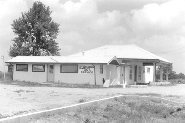 black and white photo from 1993 of a vacant gas station