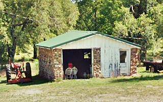 stone wall garage with gabled roof