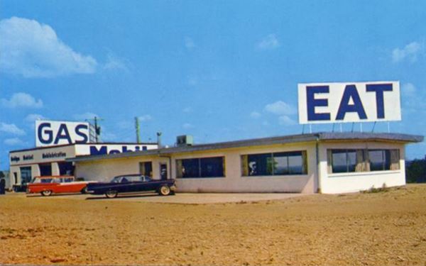 gas station, cafe and cars in an early 1960s postcard