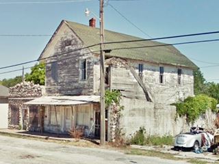 two story gable roof derelict building