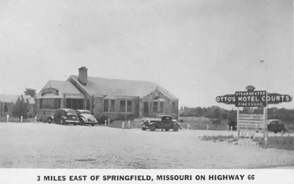 1930s postcard Otto’s Motel Route 66 Springfield MO black and white 1930s postcard cars, motel sign and gable roof stone building