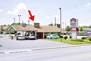 Rail Haven motel now motel office building and neon sign on a corner