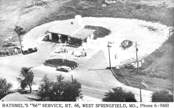 Black and white picture from 1960 of a Phillips 66 gas station seen from the air