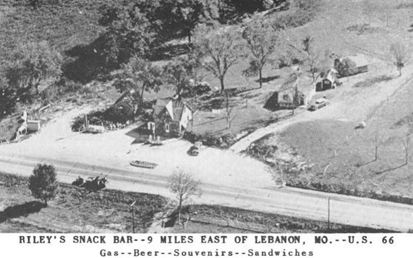 aerial view in black and white of cottage style cafe and gas station and US66