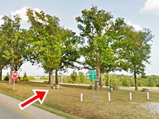 trees, grass, tables and benches in a Roadside Park beside Route 66
