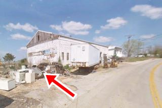 hW gable roof block building a former garage next to Route 66