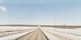 straight stretch of US66 among snowed fields