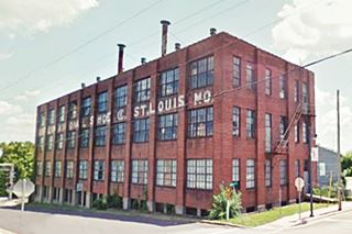 three story red brick building, block shaped