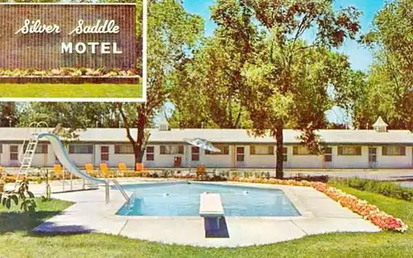 postcard of former Silver Saddle Motel postcard:pool, trees, building of Silver Saddle Motel