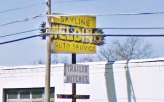 YW sign with black letters, a 1950s neon sign