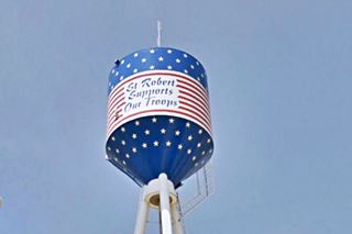 red white and blue colored water tank and "St. Robert supports our troops" written on it
