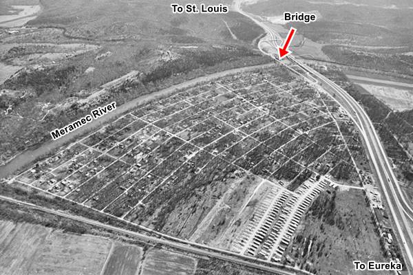 black and white aerial view, town below, freeway to the right, Meramec river beyond