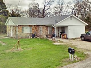 home with gable roof beside Route 66