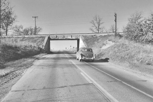 black and white photo of highway underpass