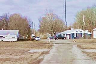 buildings next to the highway, an old motel