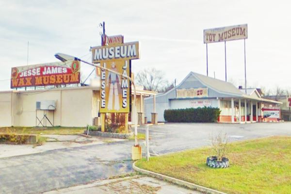 Jesse James Wax Museum building and sign shaped like a cowboy bandit, Route 66 in Stanton Missouri