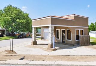old canopy style gas station on corner, now an office