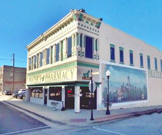 2-story corner bldg, mural on one facade