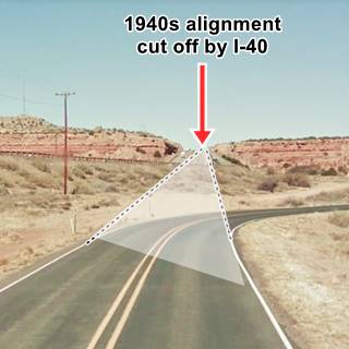 1940-50s Route 66 alignment in Mesita I-40 to the left, old 66 to the right, a sandstone cliff and hill ahead, lines and shaded tint mark the original alignment of Route 66