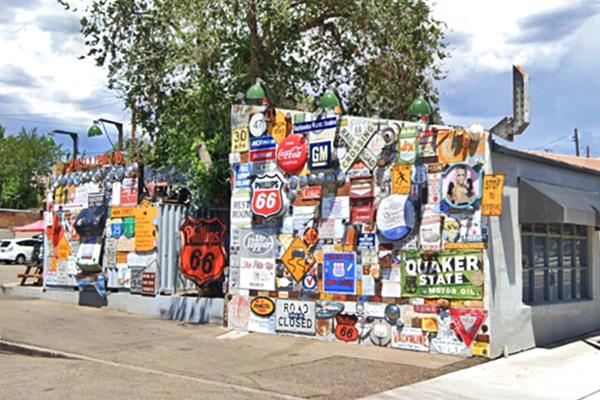 wall covered with colorful vintage enamel signs