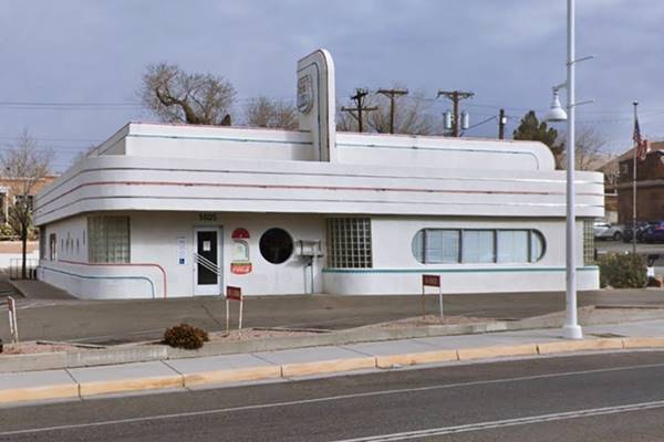 Art Moderne curved corners on single story white building seen from Route 66, a Diner