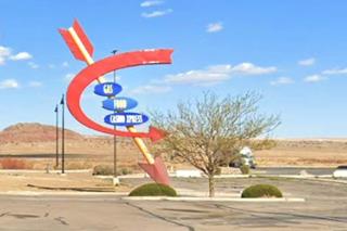 Route 66 Vistor Center arrow sign arrow with signs on it retro look on Route 66