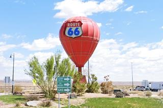 Route 66 Vistor Center balloon with US66 shield orange balloon on roundabout, US 66 shield on it