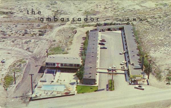 color postcard, air view 1960s of a motel U-layout, wing to the left with a pool