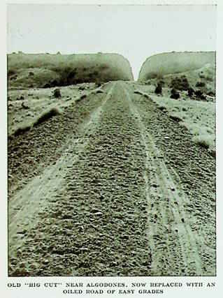 Big Cut on Route 66 Algodones magazine article Oct. 1932 monochrome, distant narrow cut in hill, dirt road with tire tracks leads to it