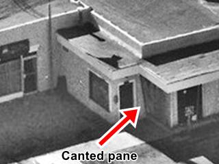 Canted pane on former Phillips 66 Moriarty US66 red arrow marks slanting window on a former gas station in a black and white 1990s picture