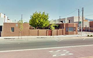 appartments, painted terracota in two parallel lines of units with Route 66 running across the image