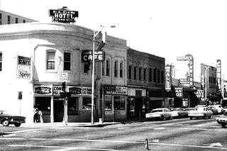 Elgin Hotel and Coney Island Cafe 1970s US66 Albuquerque 1970s black and white view 2 story corner building, cars, signs