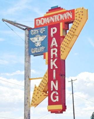 Neon sign, color: retro vintage sign in a 1950 style of a parking area in Gallup NM