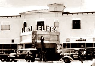El Rey in the 1940s black and white 1940s view of trucks and the marquee of the El Rey Theater