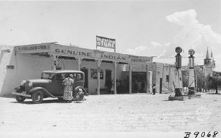 1938 El Pueblo Store Isleta NM Click to Enlarge black and white, 1938: store with a car, 2 gas pumps, people, sign reads EL PUEBLO STORE, NAVAJO RUGS, GENUINE INDIAN PRODUCTS, church to the right