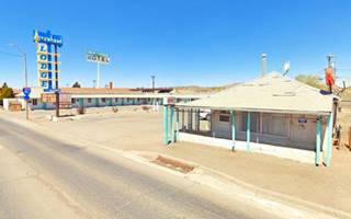 motel, single floor, gable roof, verandah, neon sign
