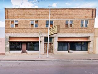 2 story brick building facing Route 66