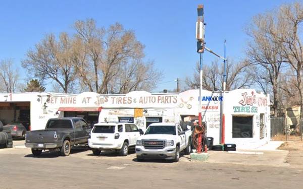 Greene Garage, US66 Moriarty tire shop on a corner, with rounded parapets and 1 service bay