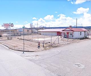 red gable roof single story building, former gas station