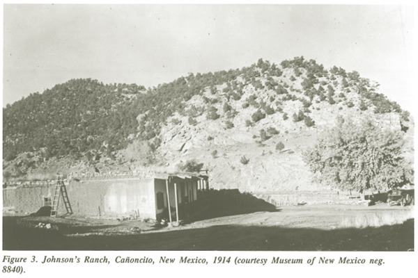 Johnson Ranch in 1914 black and white flat roof adobe ranch in a flat valley at the foot of hump shaped hill with shrubs