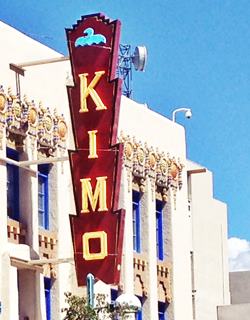 Kimo Theater neon sign by A. Whittall KIMO theater sign, red background jagged edge, yellow letters