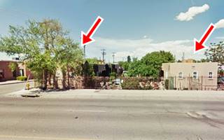 Luke Apartments view of two block shaped buildings facing street, on a corner marked with 2 red arrows