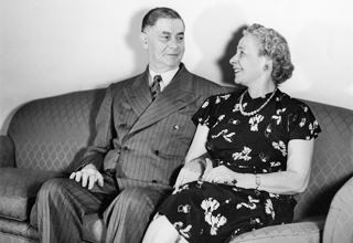 Maurice and Cyma Maisel c.1940s black and white 1940s photo of a couple sitting on a couch Mr. Maurice Maisel and his wife Cyma