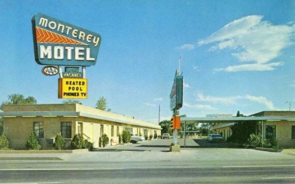 Vintage 1960s postcard of the Monterey Motel, U-shaped layout, office with flat canopy, Route 66 runs in front, neon sign inset in the image